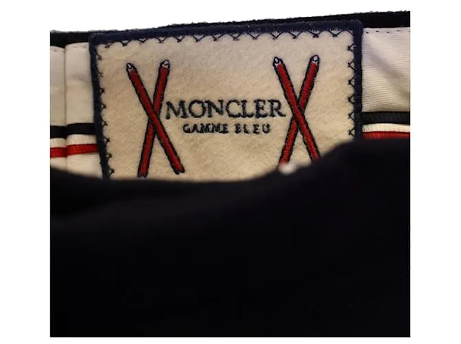 Pantalón Moncler con botones a presión dorados en lana azul marino 